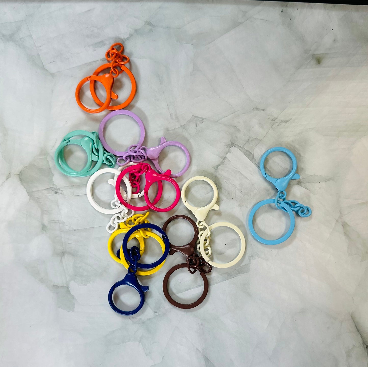 Colorful keychains on a marble surface