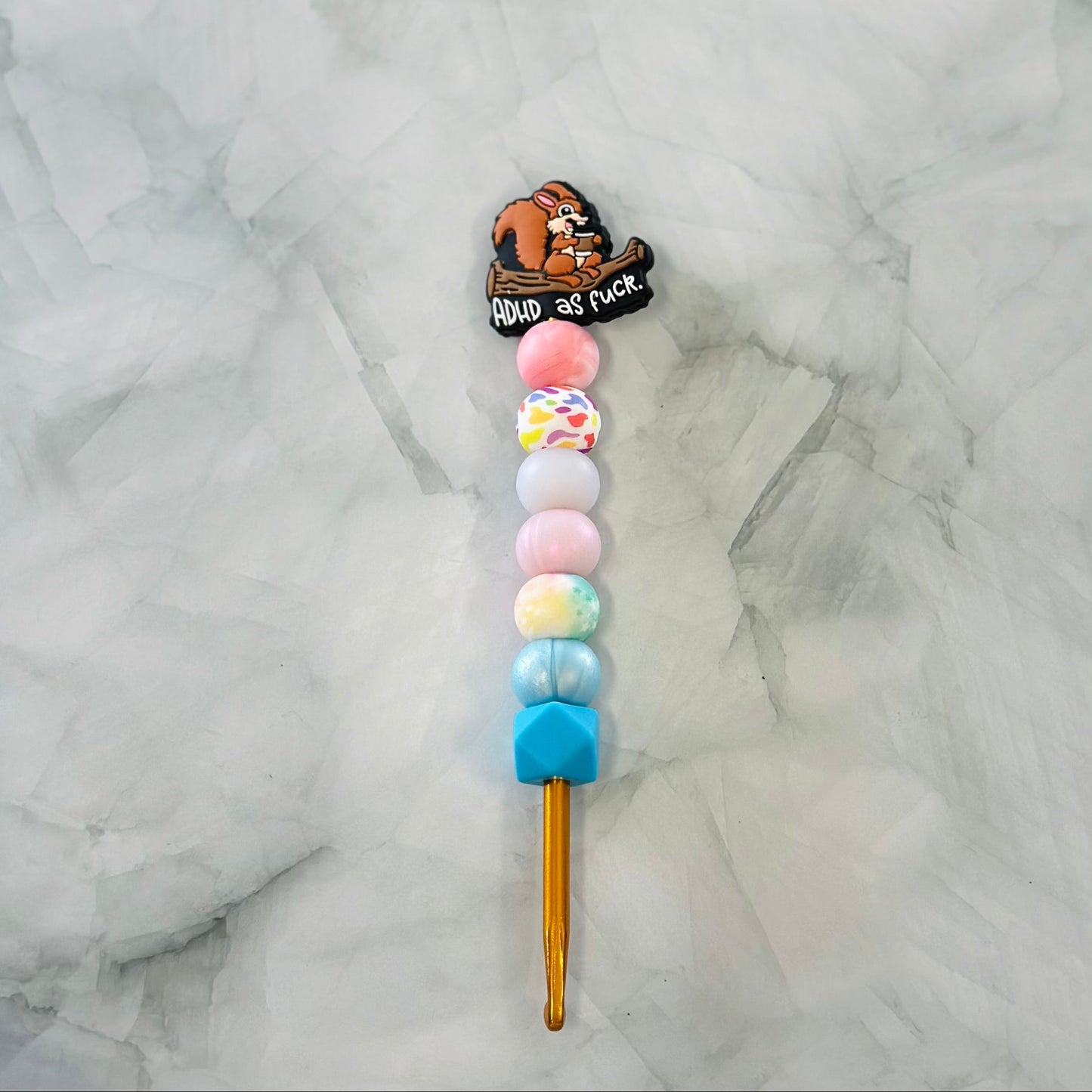 Colorful lollipop with a bear character and text on a marble background