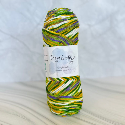 Multicolored skein of yarn with a label on a textured surface