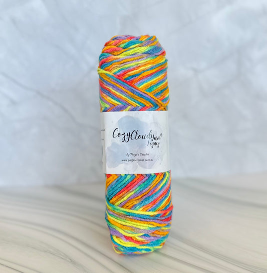 Multicolored yarn skein with a label on a light gray background