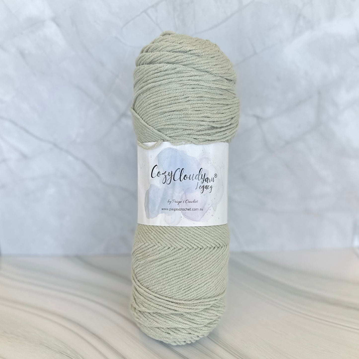 Ball of yarn with a label on a textured white background
