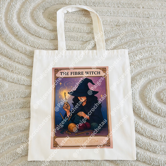 Tote bag with 'The Fibre Witch' design on a textured surface