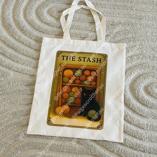 Cozy tarot crochet tote bag with comforting yarn-themed illustration, ideal for carrying WIPs, yarn, and crafting supplies