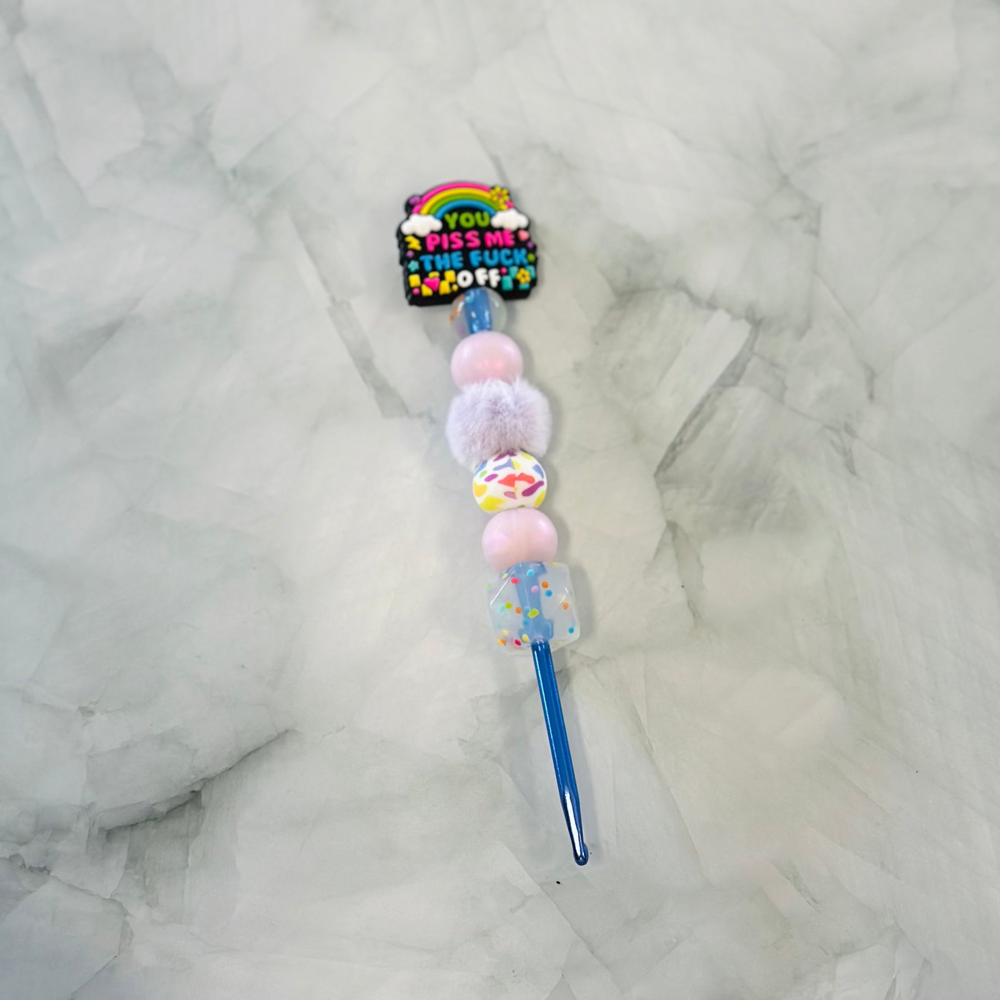 Decorative Crochet hook with colourful beads and text on a marble surface, works with Plush yarn 