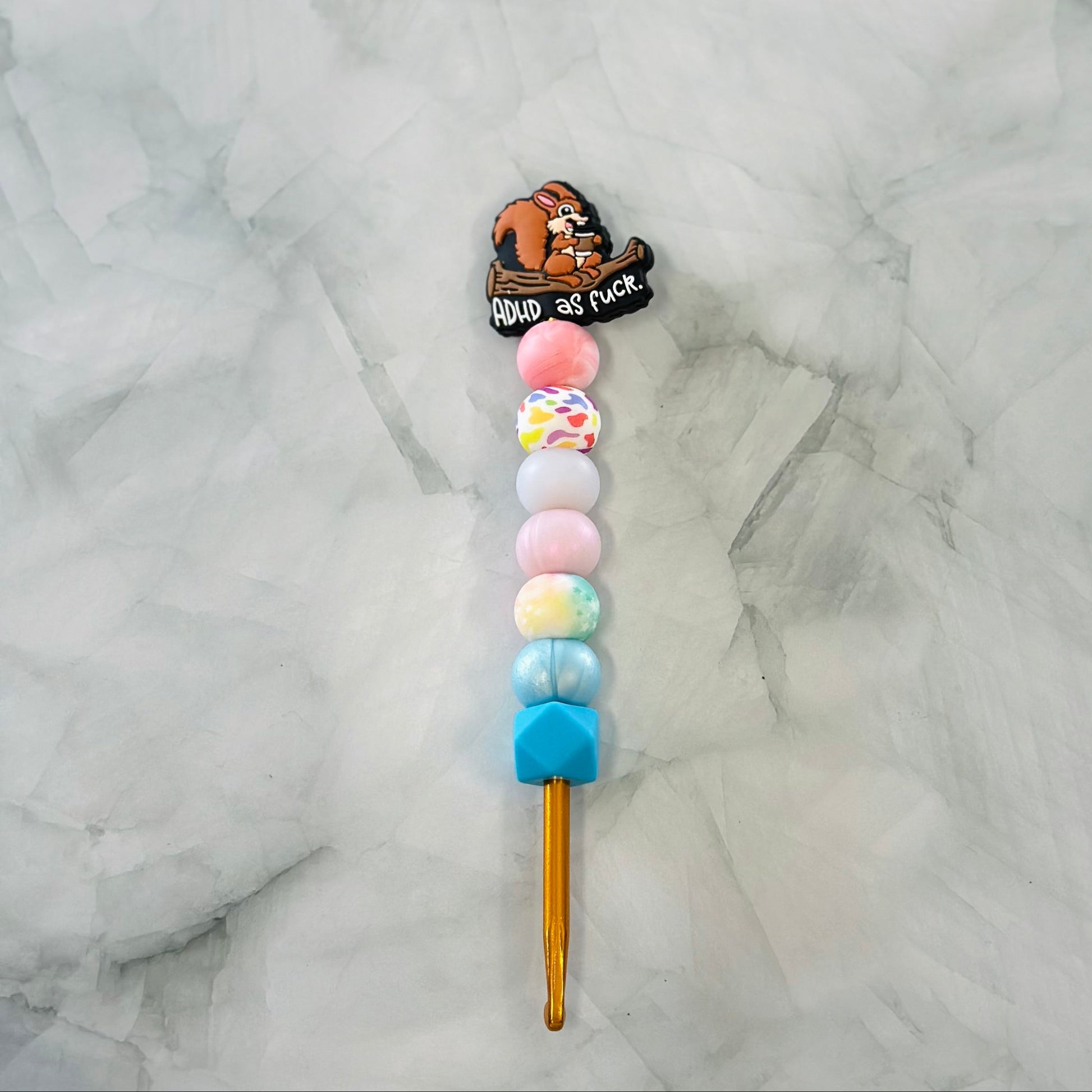 Colorful lollipop with a bear character and text on a marble background