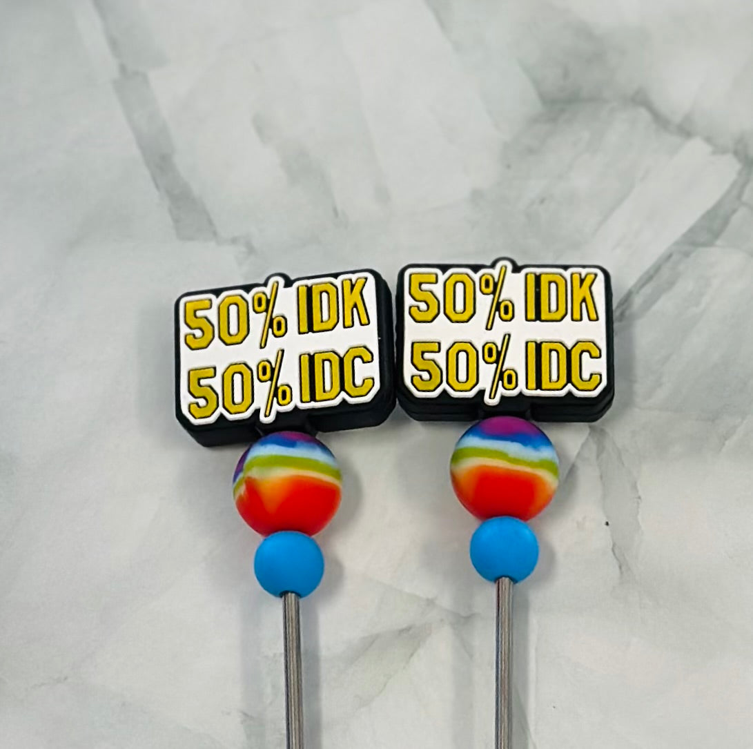 Two colorful stitch sticks with text on a marble background