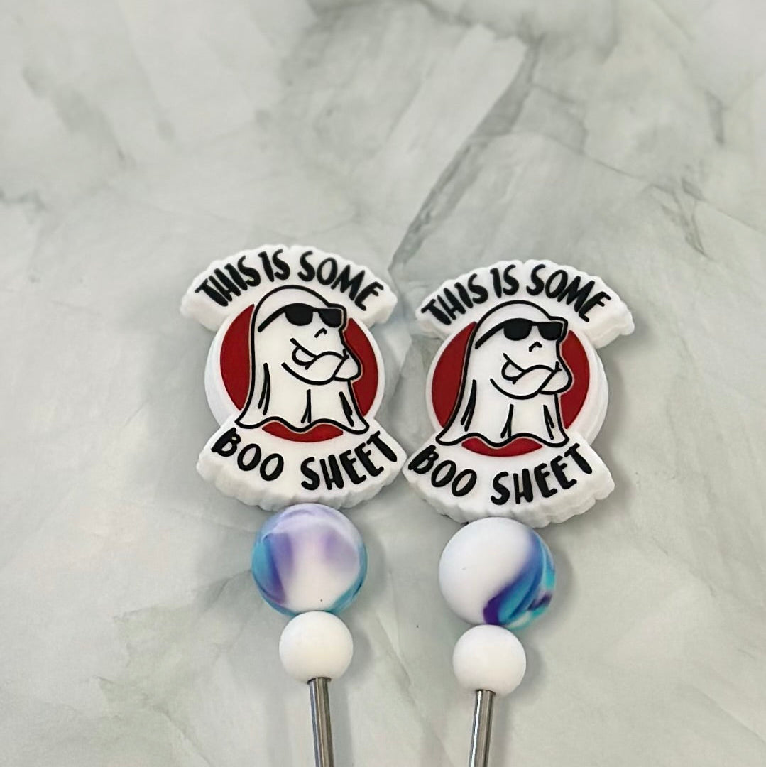 Two decorative stitch sticks with cartoon character design and text on a marble background chenille yarn , plush yarn, amigurumi 