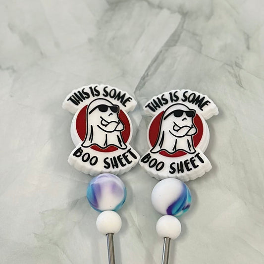 Two decorative stitch sticks with cartoon character design and text on a marble background chenille yarn , plush yarn, amigurumi 