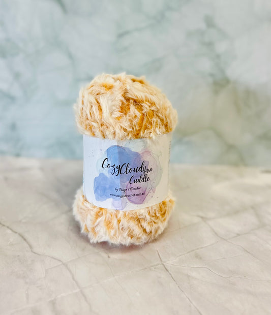 Ball of yarn with a label on a textured surface