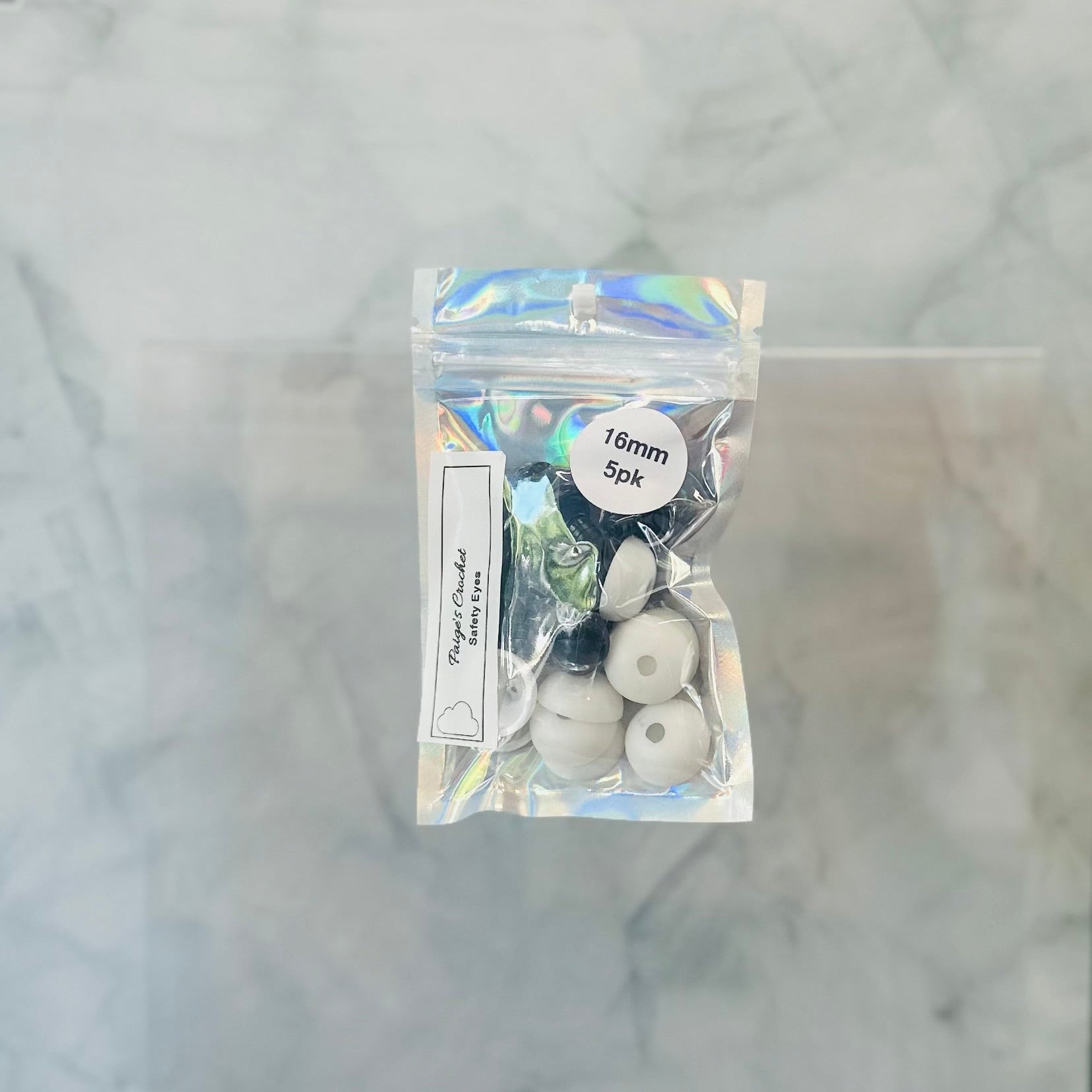 a holographic package of off centre safety eyes 