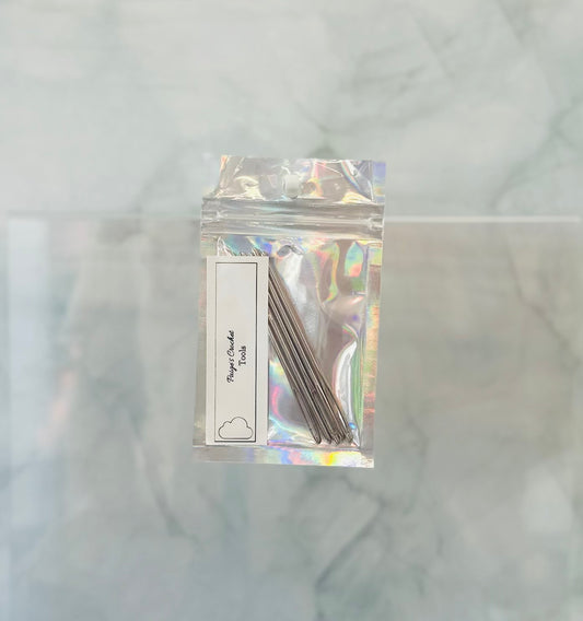 Holographic packaging with metal needles on a marble background