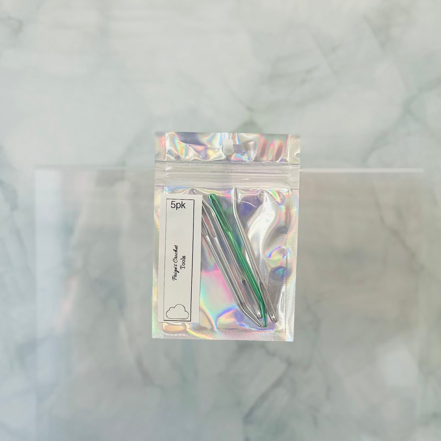 a 5 pack of bent tip danring sewing needles 