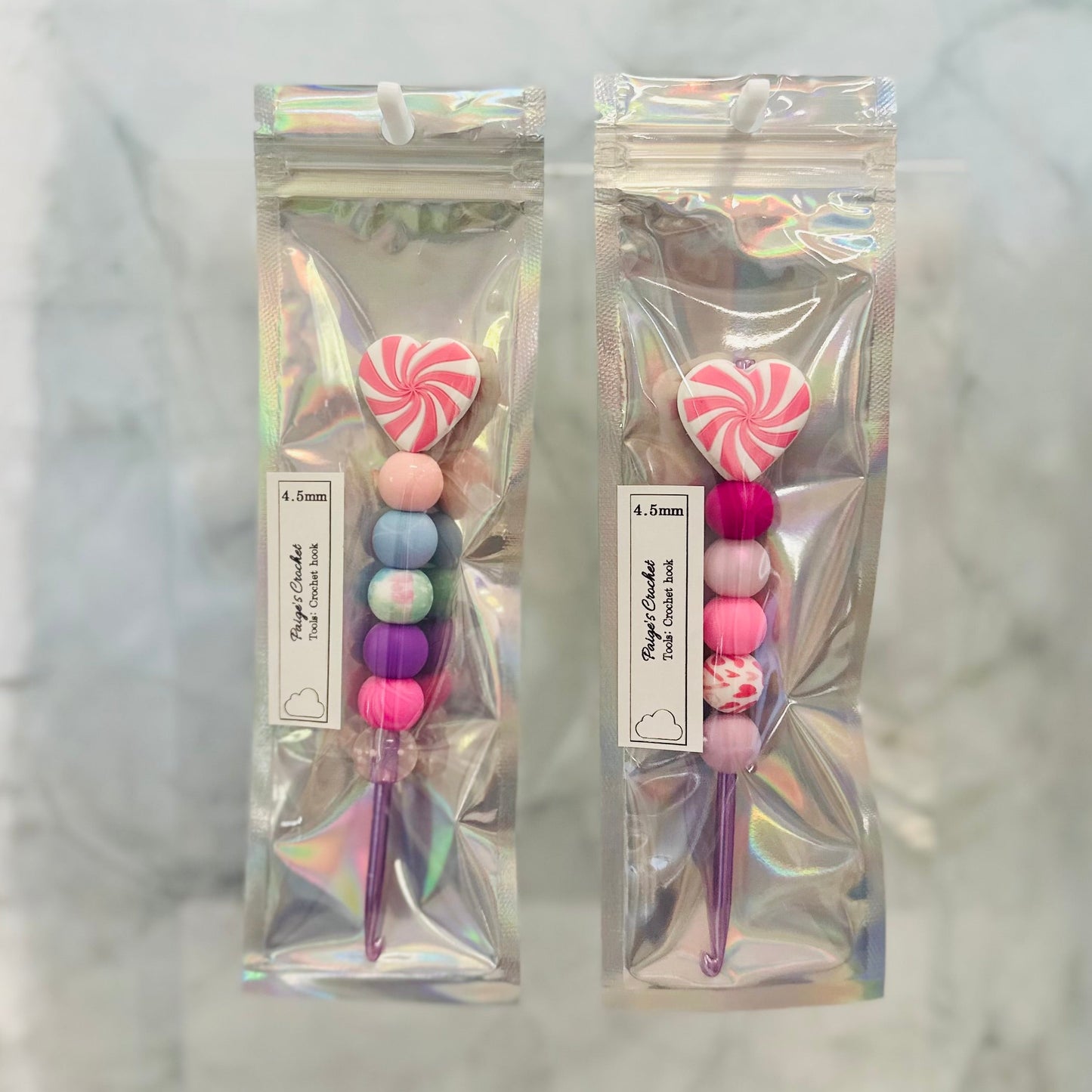 4.5mm crochet hooks with colourful silicone beads and heart shaped beads on top 