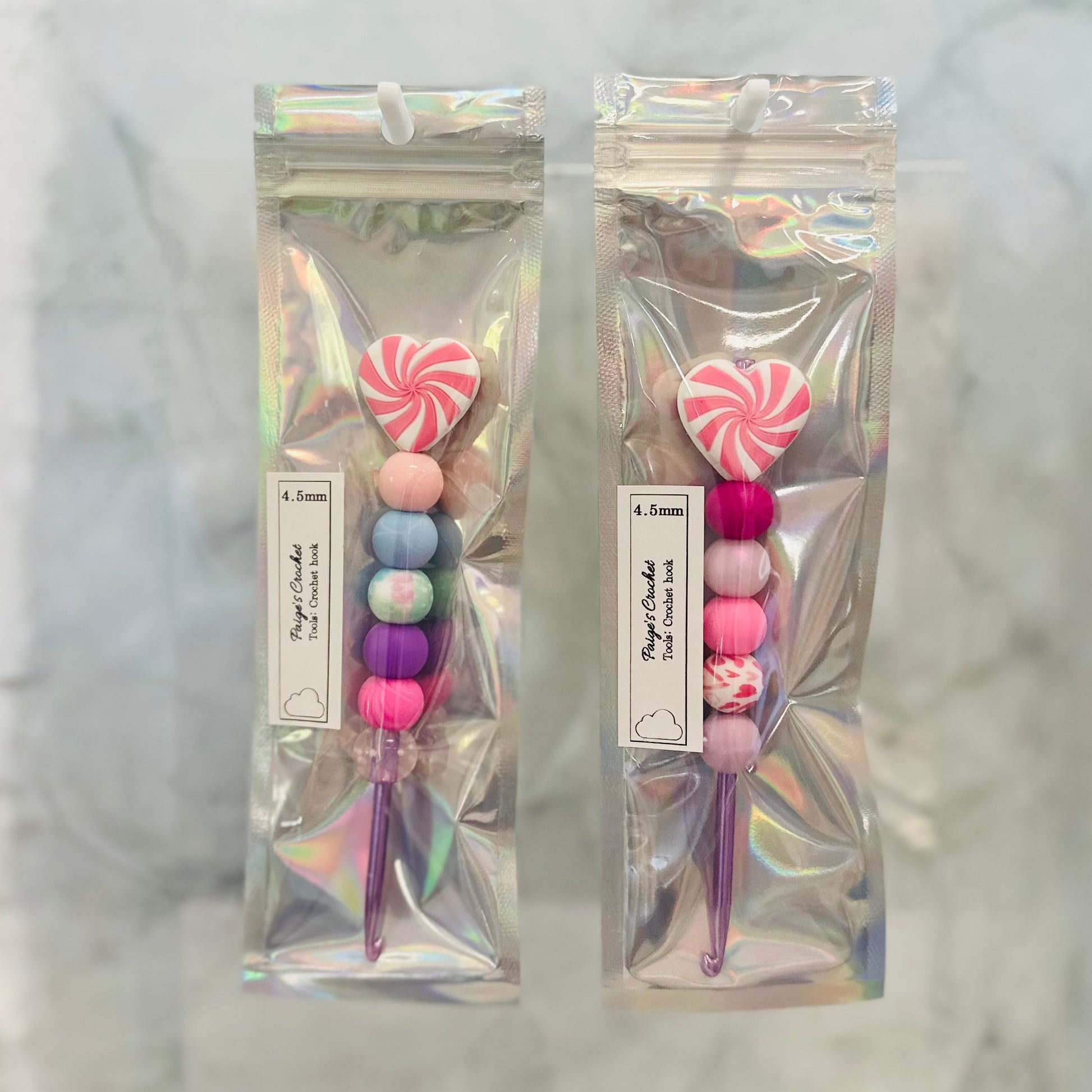 4.5mm crochet hooks with colourful silicone beads and heart shaped beads on top 