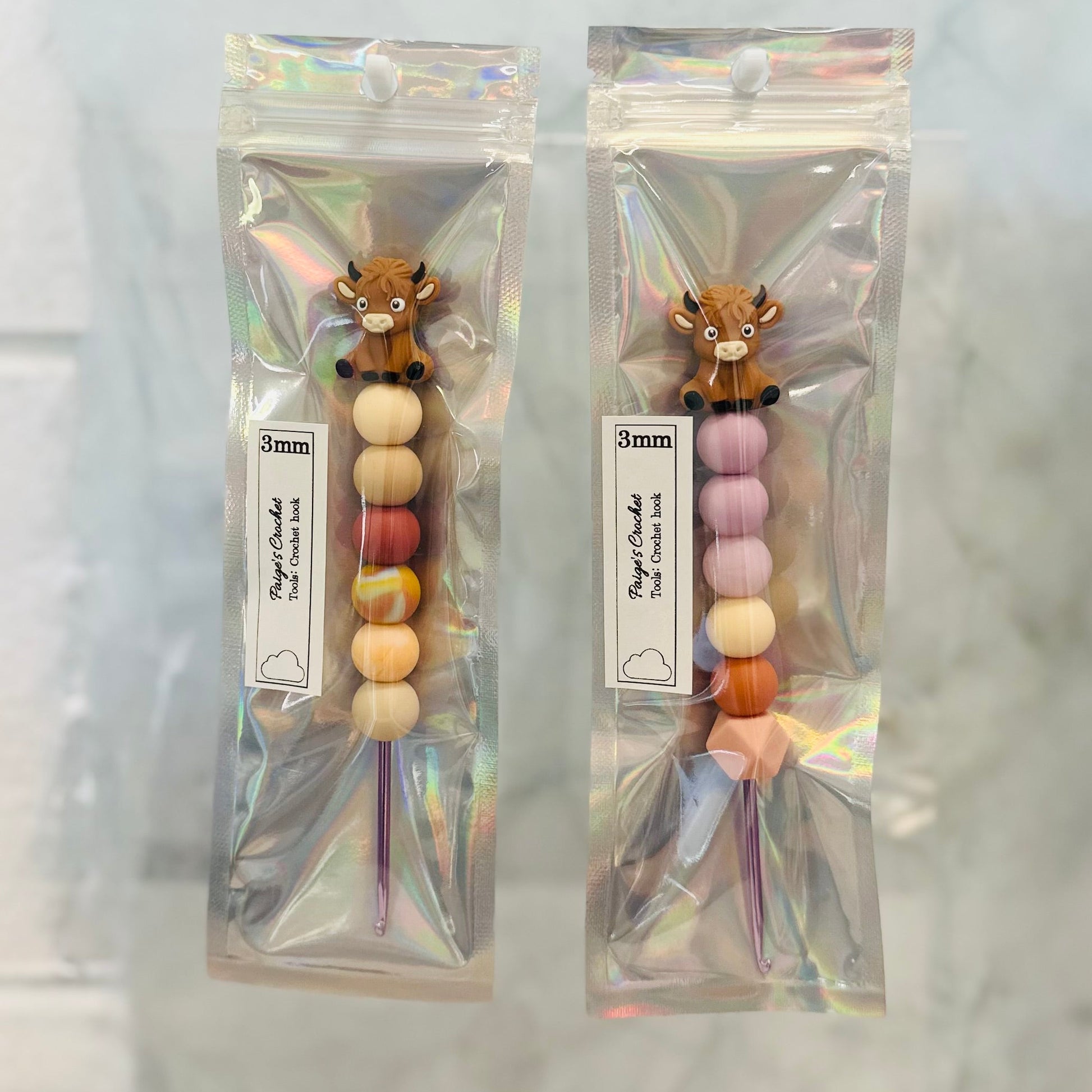 silicone bead crochet hooks in 3mm with a highland cow bead sitting on top