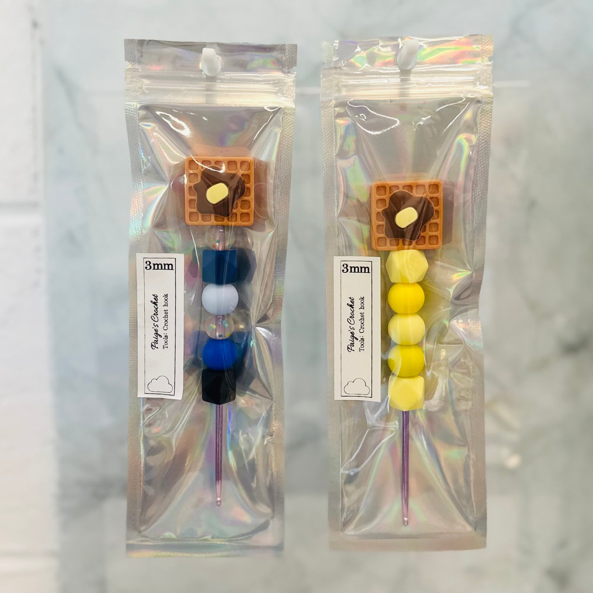 two silicone bead crochet hooks in 3mm, with silicone bead waffles on top 