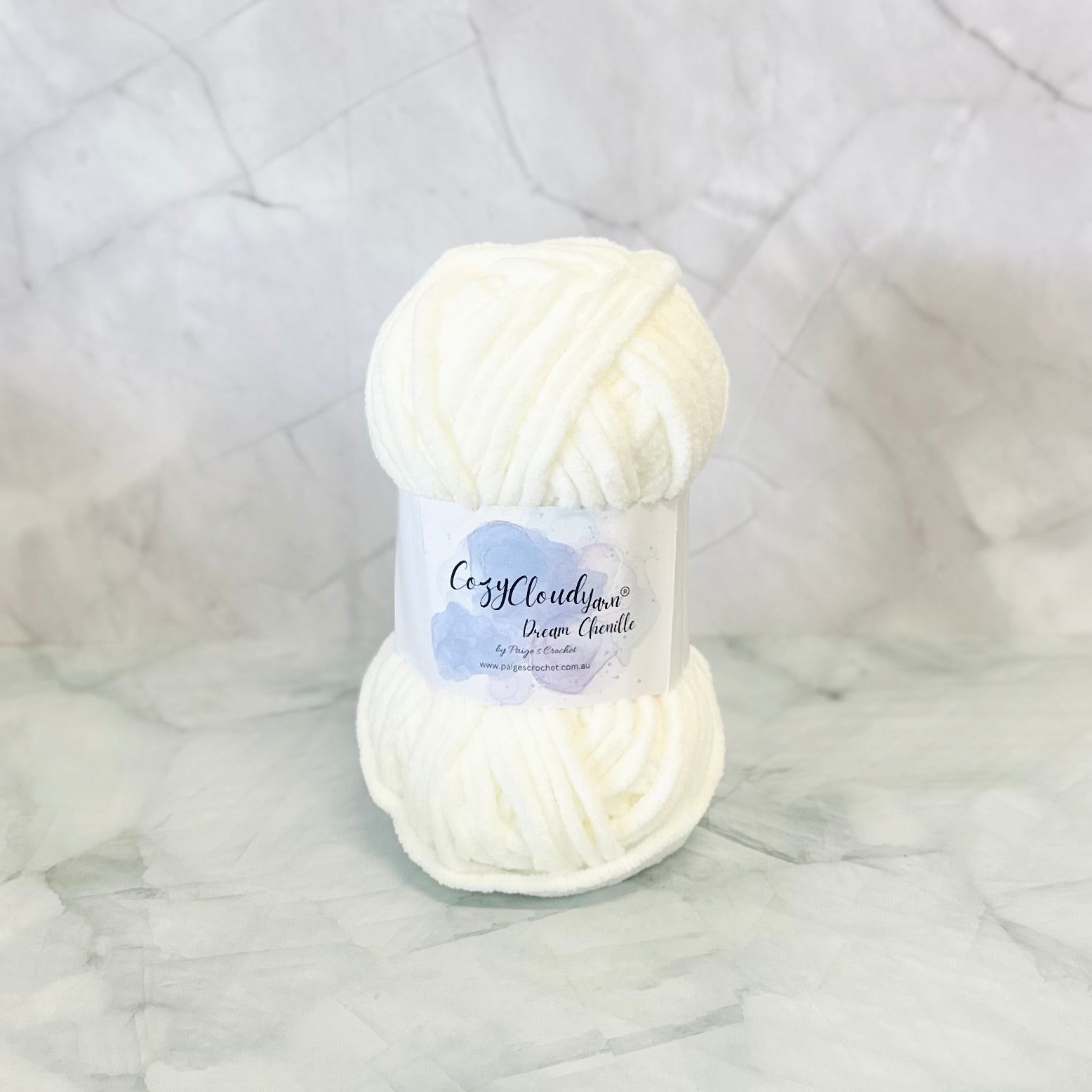 Cream ball of plush chenille yarn 
