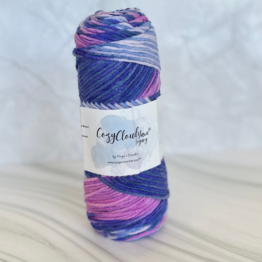 Multicolored yarn ball with a label on a white background