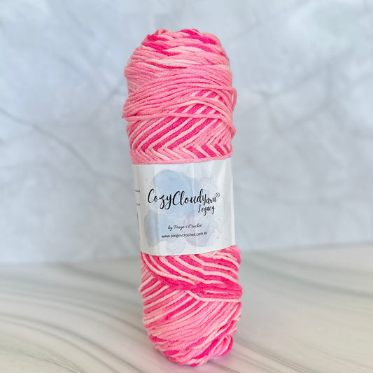  multi colour Pink yarn ball  pf 10 ply acrylic yarn with a label on a white background