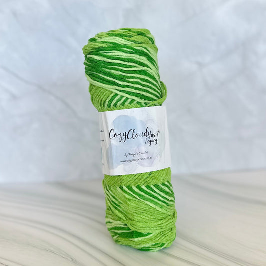 Green skein of yarn with a label on a white background