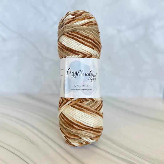 mixed brown 10 ply acrylic yarn with a Cozy Cloud yarn label 
