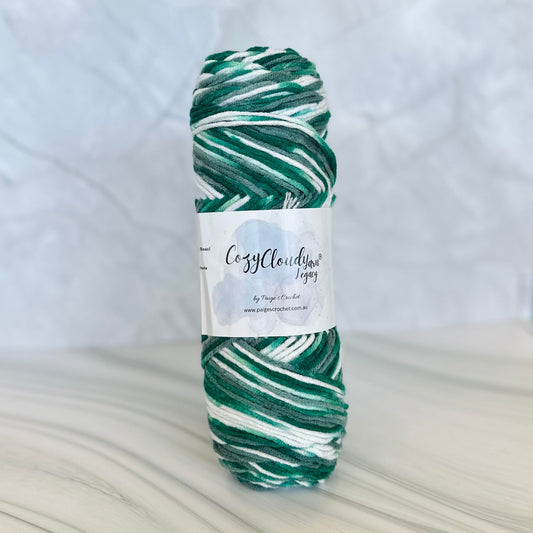 Green and white skein of yarn with a label on a white background
