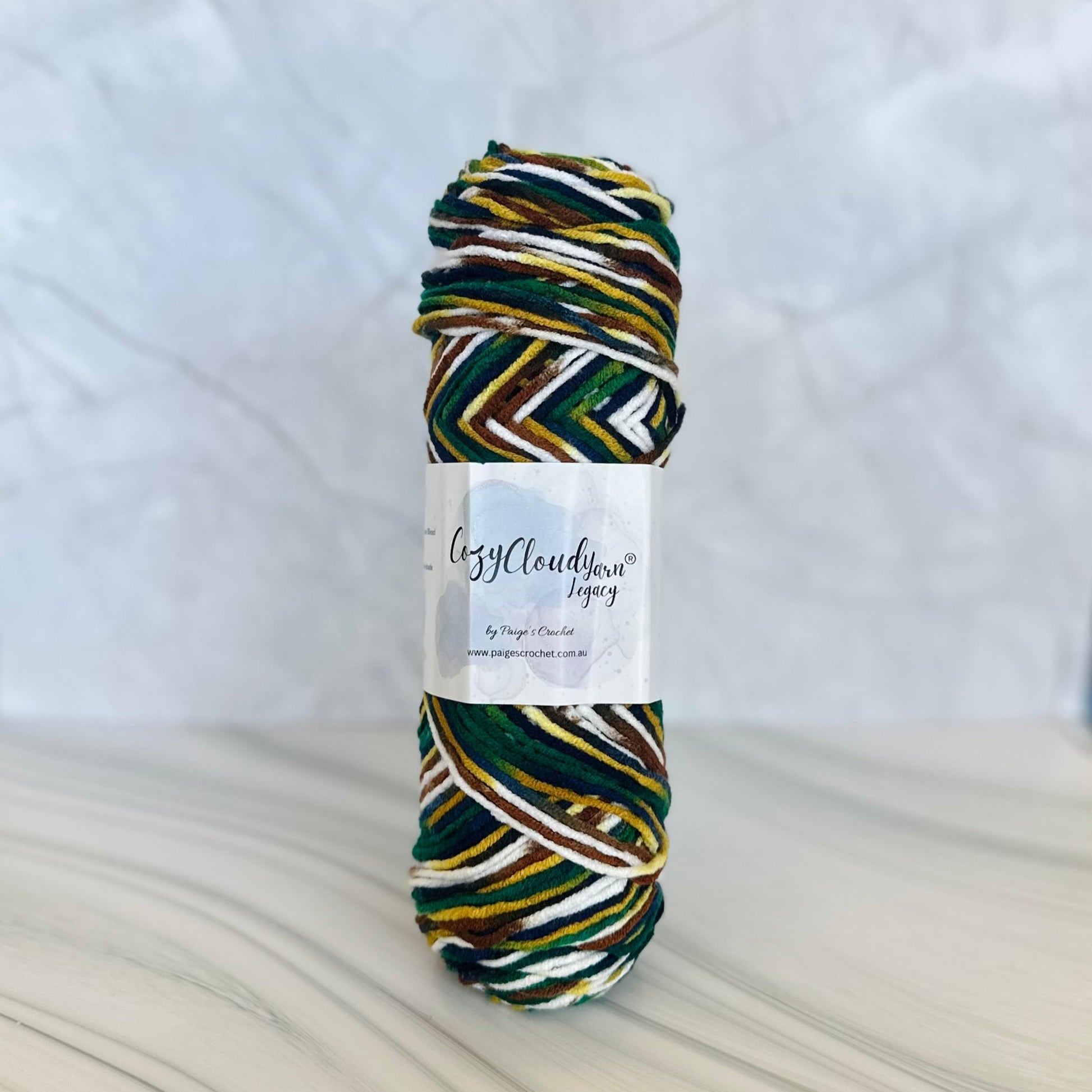 Multicolored skein of yarn with a label on a white background