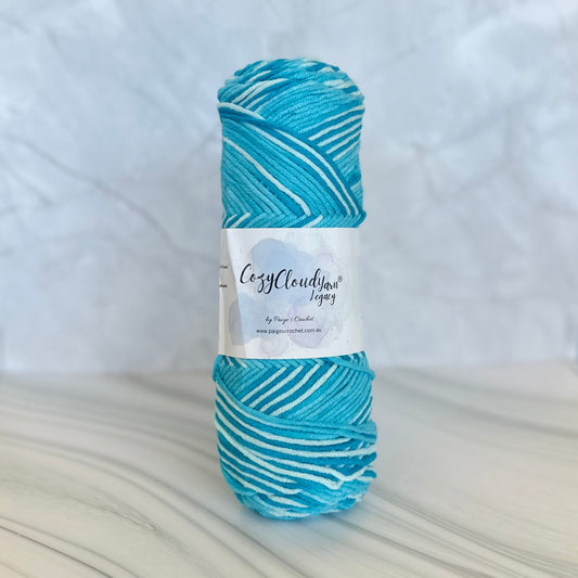 Blue and white yarn ball with a label on a white background