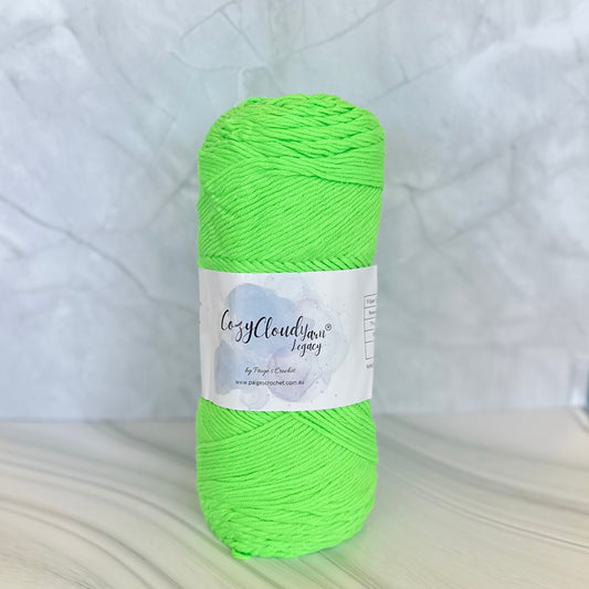 Neon green skein of yarn with a label on a white background