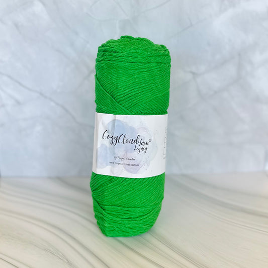 Green skein of yarn with a label on a white background