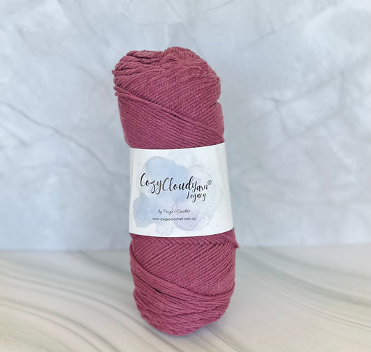 Ball of yarn with a label on a textured white background