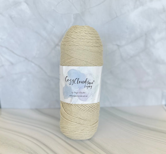 Ball of yarn with a label on a textured white background