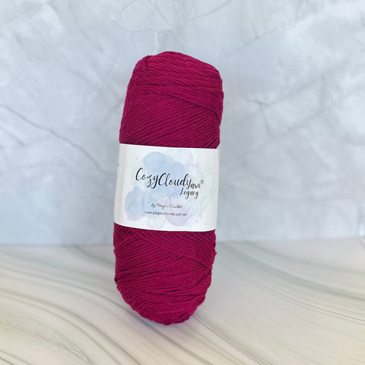 Ball of yarn with a label on a textured white background