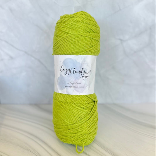 Green skein of yarn with a label on a white background