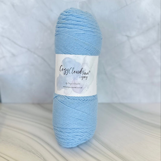 Light blue skein of yarn with a label on a white background