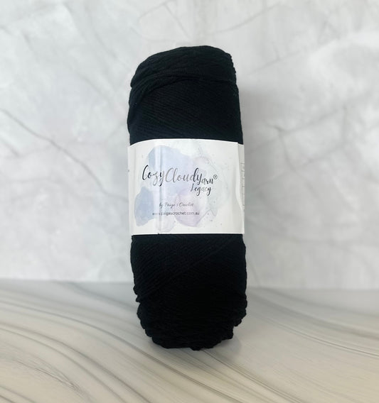 Black skein of yarn with a label on a white background