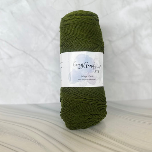 Green skein of yarn with a label on a white background